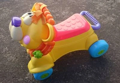 fisher price walk and ride lion