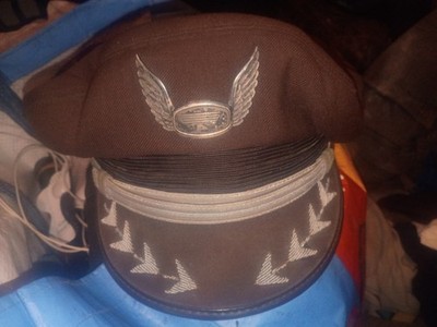 Western airlines pilot hat with gold buttons and silver wings on the front