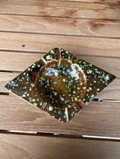 Vintage  ceramic ashtray with a speckled, drip glaze finish, mid-20th century