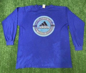 the brand with the three stripes shirt