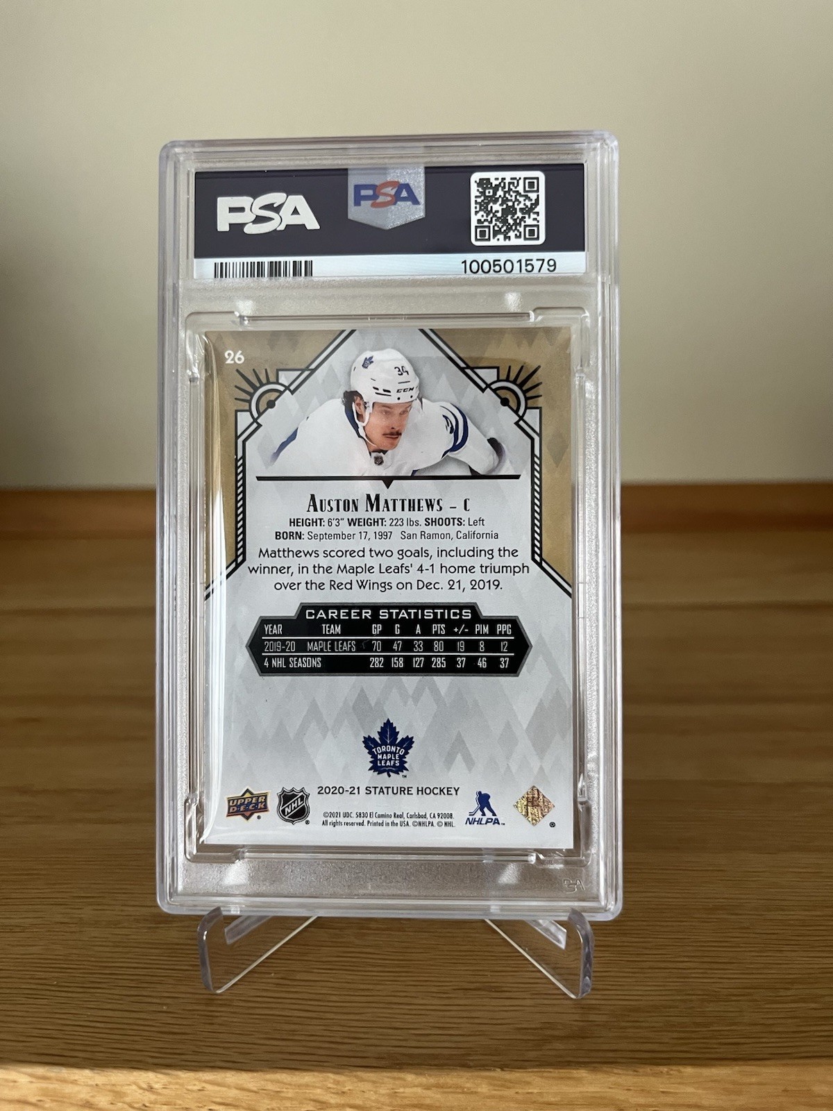 2020-21 Upper Deck Stature Auston Matthews #26 Red /85 PSA #8 view 2