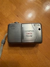 Olympus CAMEDIA C-50 Zoom 5.0MP Digital Camera - Silver and battery charger