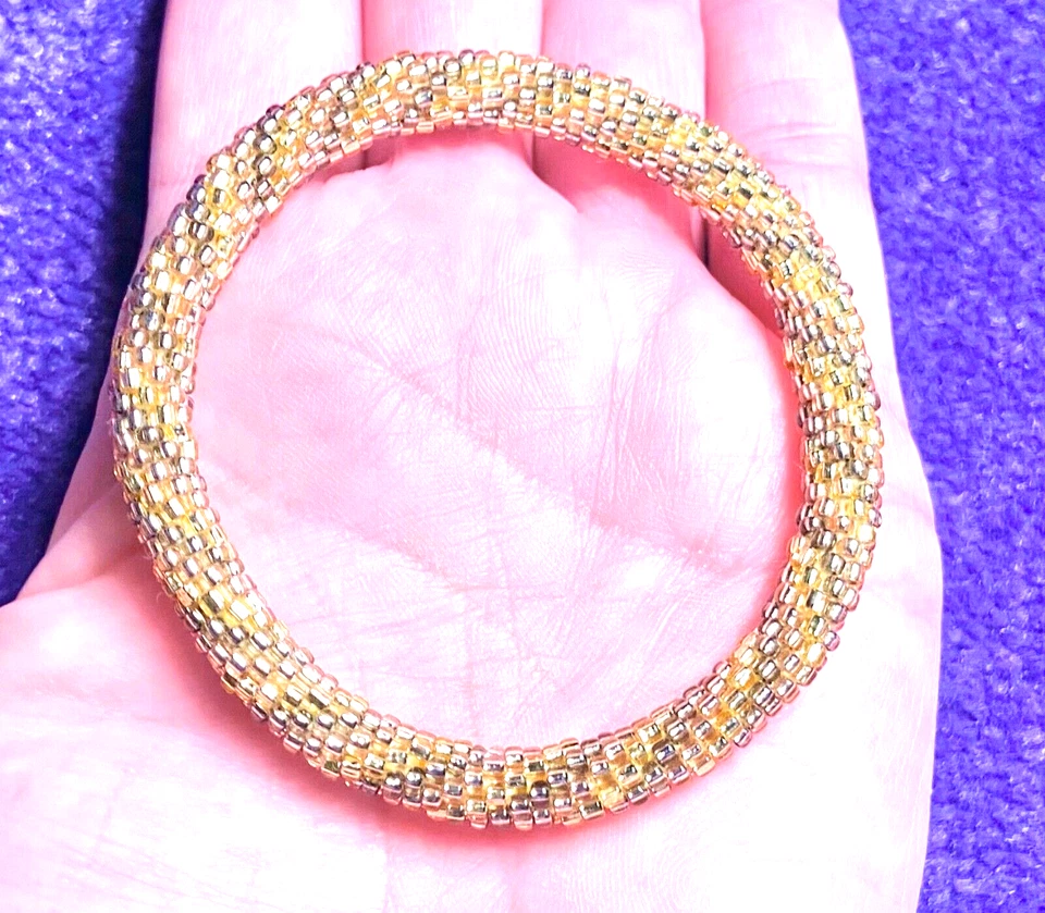 BRAZALETE/PULSERA CON CUENTAS DE VIDRIO TONOS DORADOS MARCA LUCKY EN MUY BUENA CONDICIÓN Foto 2 de 4