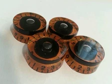 4 Guitar speed volume / tone knobs. Black/Orange. JAT CUSTOM GUITAR PARTS