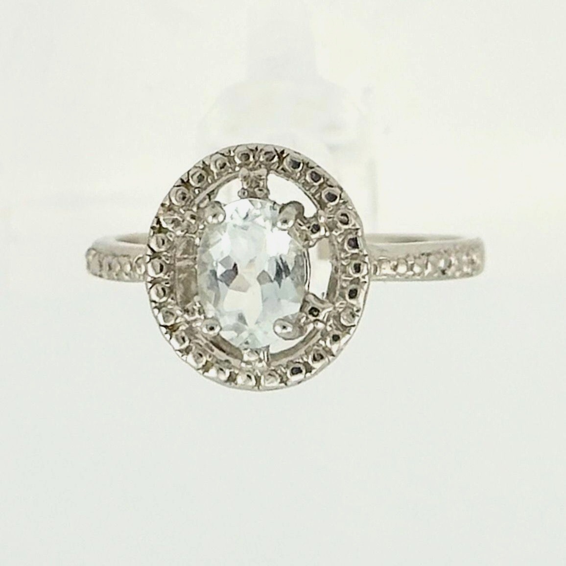 Lovely Floating Halo Oval Aquamarine Gemstone Ring with Diamond