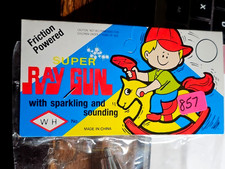 VINTAGE NIP Friction Powered Toy SUPER RAY GUN Sealed Package MINT