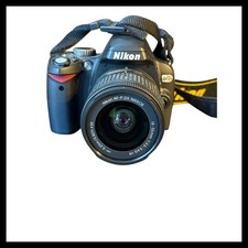 Nikon D60 Digital SLR Camera with 18-55mm VR Lens and Nikon Strap