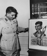 Egyptian General Muhammad Naguib admires a cartoon of himself Orig- Old Photo