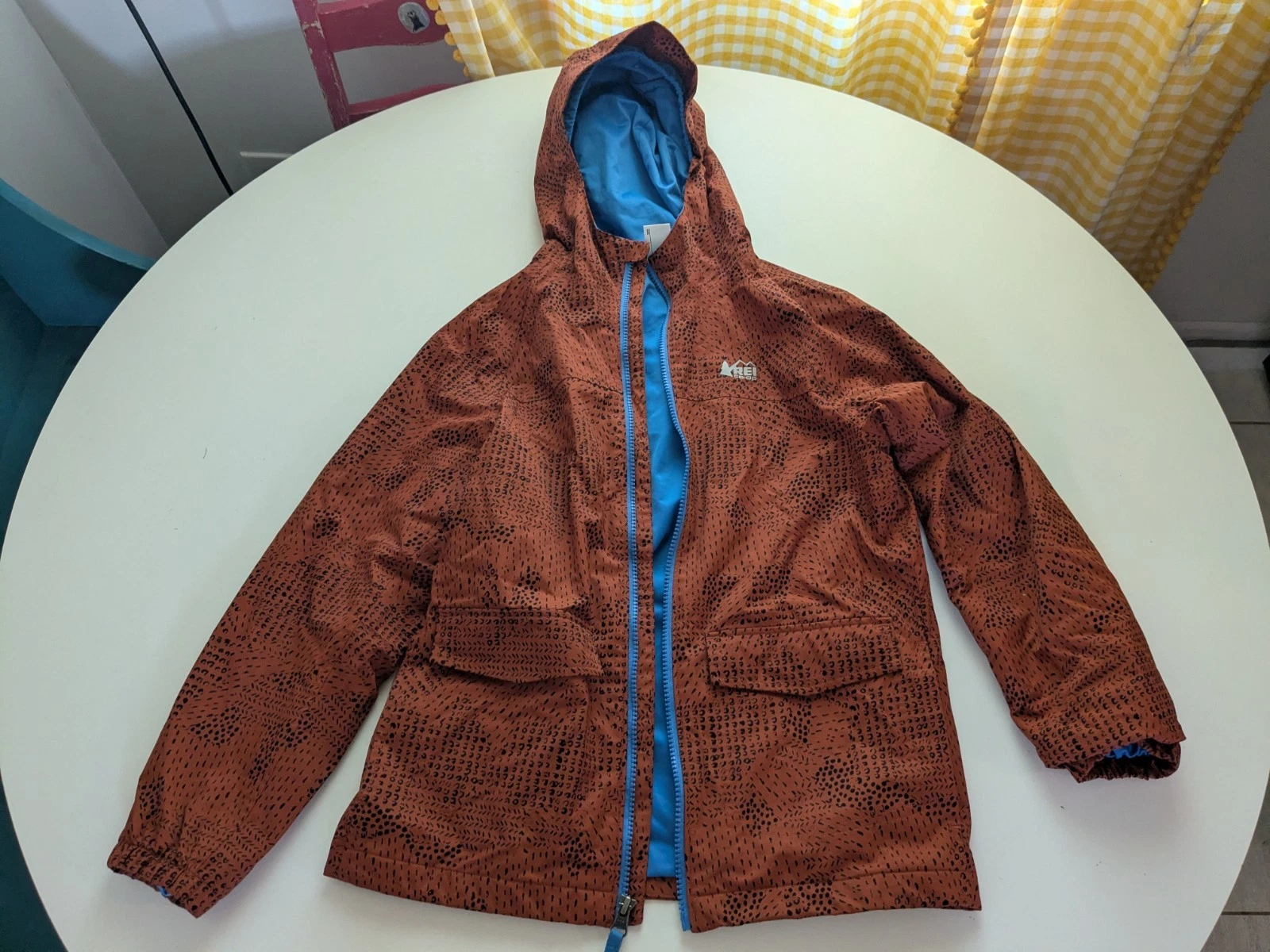 REI Co-op Boys Sz M 10-12 Kids Rain Jacket Raincoat Orange Print Hood Lined EUC