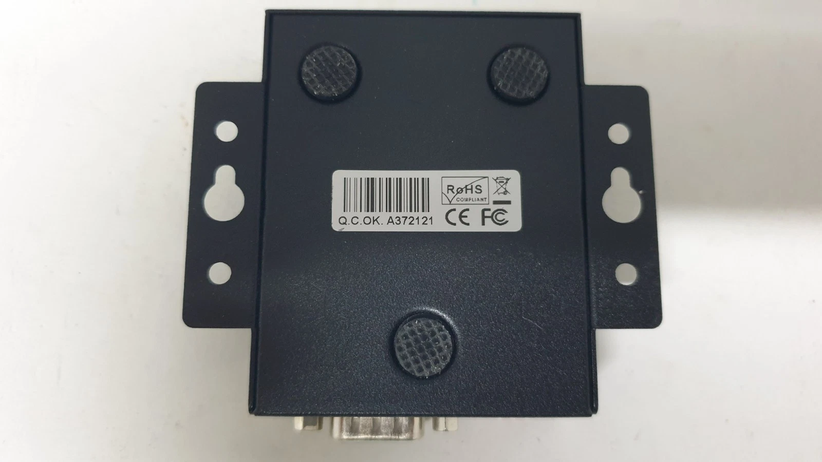Underside of the ES-U-2101-MB metal case with mounting flanges and CE, FCC, RoHS label