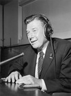 American broadcaster Arthur Godfrey sits at a radio microphone wear- Old Photo