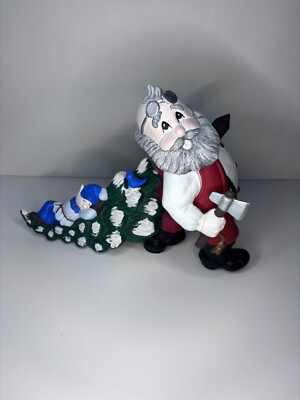  Ceramic Santa pulling sleeping elf on Christmas tree.  8 tall Hand Painted