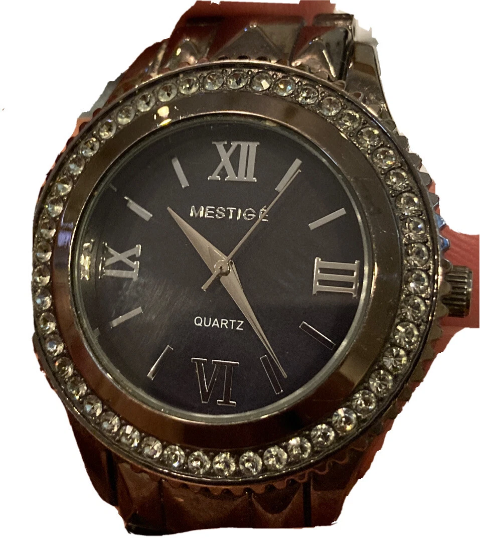 Mestige timepiece top