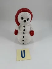 A vintage hand-painted ceramic snowman figurine from a Kimble mold.