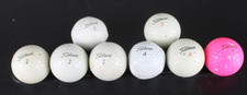 Titleist Pro V1 Mixed Lot of 8 Used Golf Balls 7 white and 1 Pink