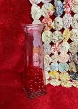 Pink Colored Glass Bud Vase with Red Faux Glass Heart Shapes