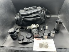 Lot of Pentax Pentax ZX-30, w 3 Camera Lenses, and Travel Case Not Tested C 
