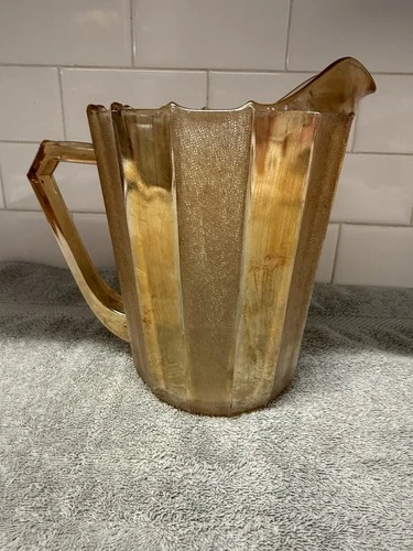 Vintage Iridescent Paneled Orange Glass Pitcher. Light Orange /Peach Color