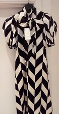 Brand new beautiful ivory and black Gucci gown. Fast and secure delivery.