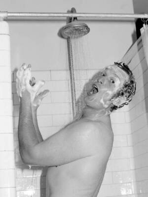 George Sharp of Northamptonshire celebrates in the shower after th- Old Photo