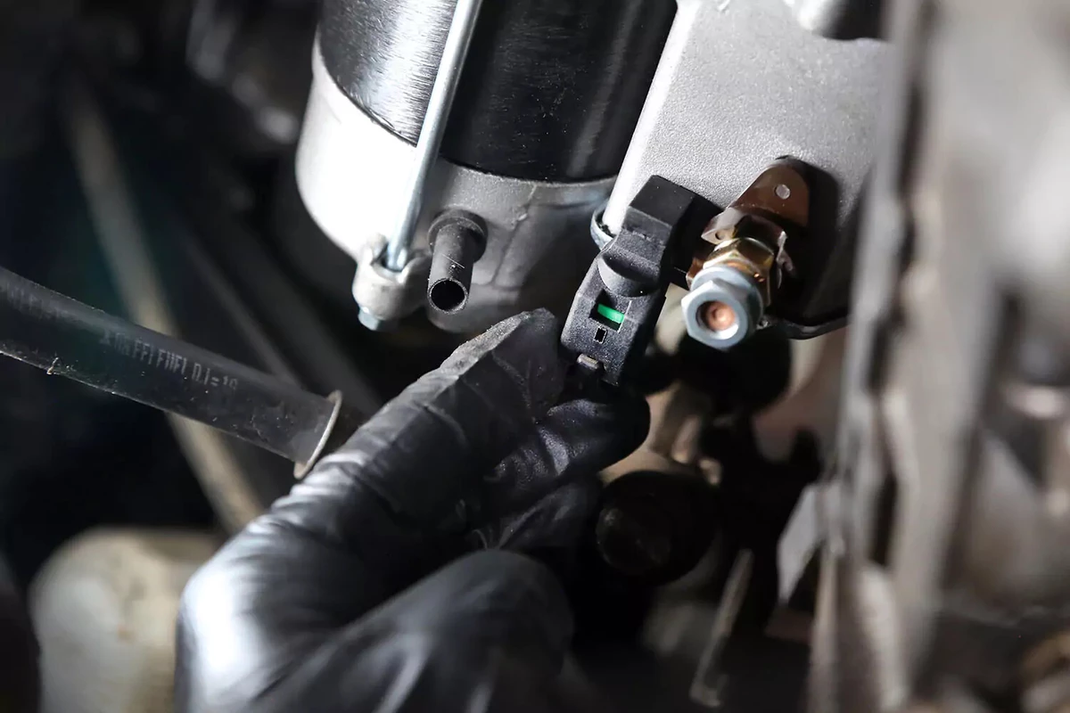 Reconnecting the starter trigger wire.