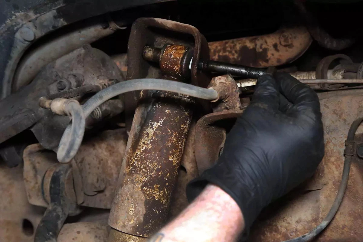 Removing the upper shock mount bolt.