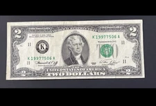 ERROR $2 DLL BILL - MISCUT, WIDE TOP AND LEFT, SERIAL #: 1997XXXX, SERIES 1976.