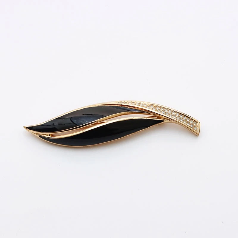 Broche Christian Dior strass doré et noir Ws11432 occasion, bijou élégant