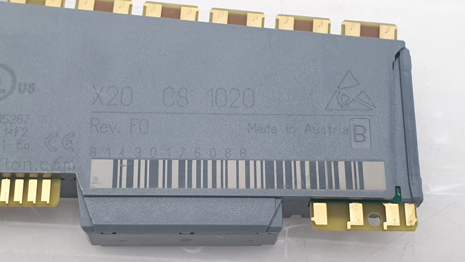 Close-up of X20 CS 1020 Rev. F0 marking, Made in Austria, with barcode