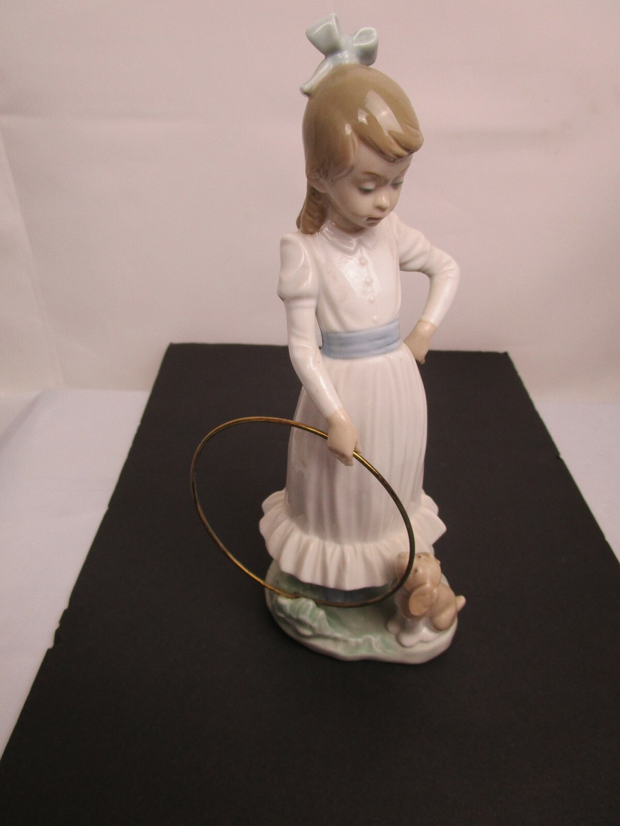 NAO by Lladro figurine #0379 “My Dog Does Tricks” - Girl with Hoop