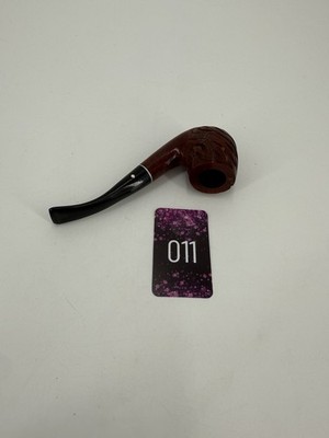A carved briar wood tobacco pipe with a bent stem and white band.