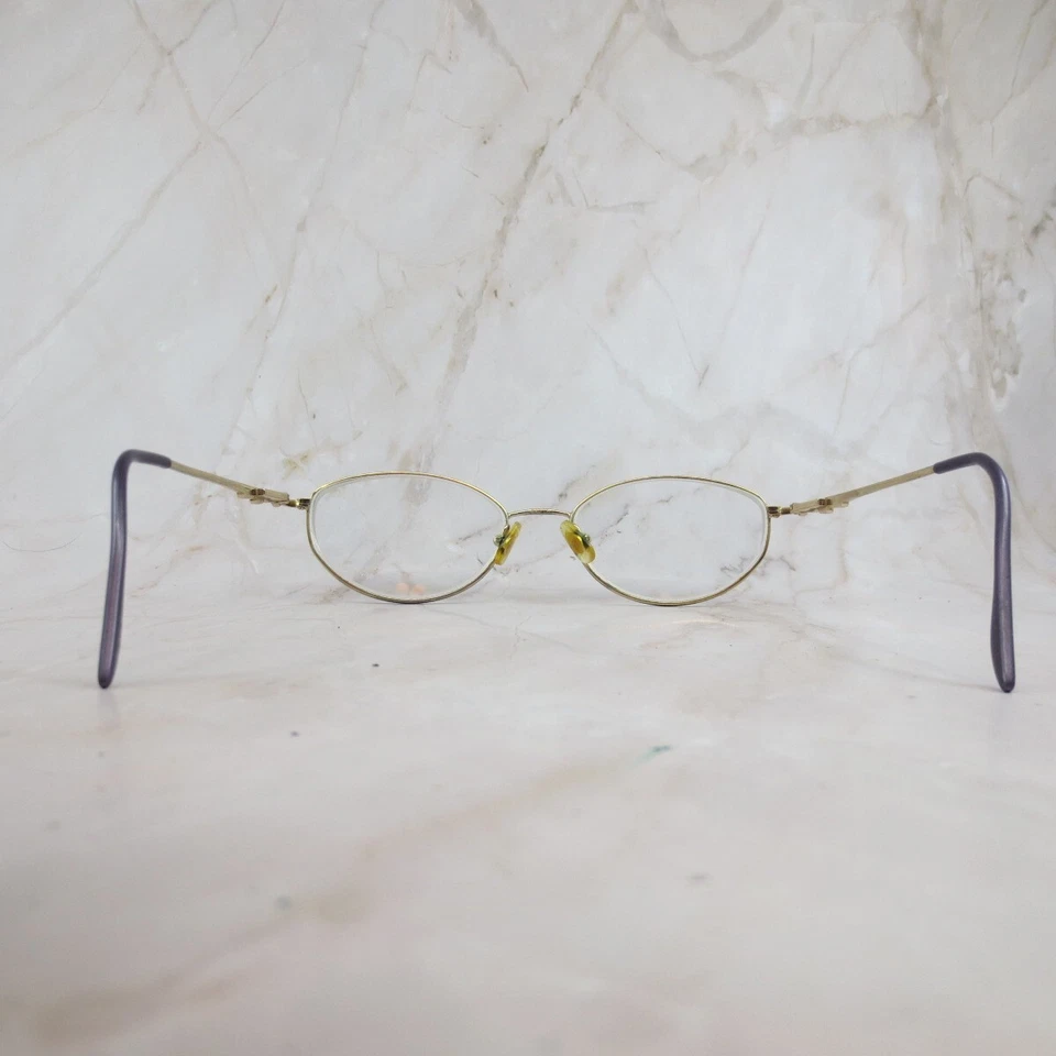 Marco de gafas Marchon 505 para mujer de metal dorado forma ovalada borde completo 54-17-135 Foto 4 de 4