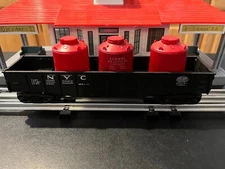LIONEL POST-WAR #6062 BLACK NYC GONDOLA WITH 3 RED CANISTERS.   O GAUGE.