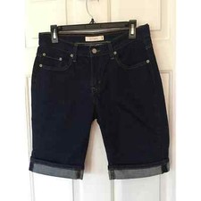 Levi s 515 Size 8 Cuffed shorts, mid rise dark.