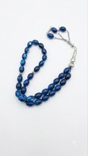Beautiful blue Islamic prayer beads featuring an elegant detailed silver tassel
