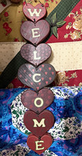 Wooden heart welcome sign.