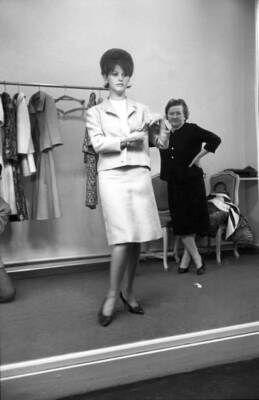 Claudia Cardinale trying on a dress at Nina Ricci's fashion house - Old Photo