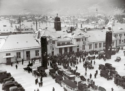 Travellers front of railway station of Garmisch Partenkirchen duri- Old Photo