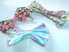 3 FLORAL ANDMETALLIC SILVER BOW HAIR CLIPS NWT