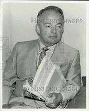 1970 Press Photo Real estate developer Herbert Handley holds documents.