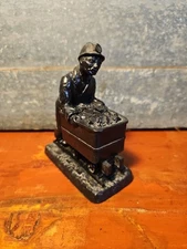 E & J collectibles Ltd made with British coal miner Pushing Mine Cart