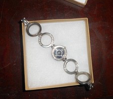 Women's Battery watch Silver tone stone face and stone in the watch rings