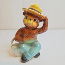 Vintage Norcrest Smokey The Bear Ceramic Coin Piggy Bank on Stump Holding Bucket
