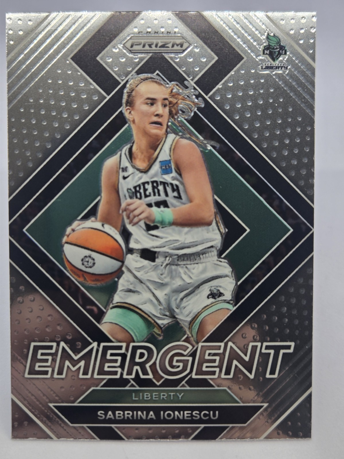 Sabrina Ionescu #4 Basketball Cards 2022 Panini Prizm WNBA Emergent trading card — raw and PSA graded price guide