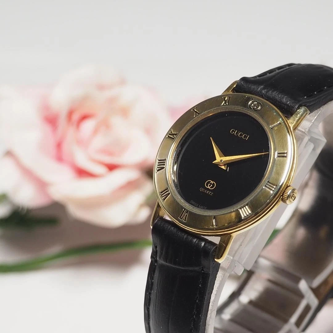 Montre femme Gucci bracelet cuir quartz or F195   nettoyée et prête à l'emploi