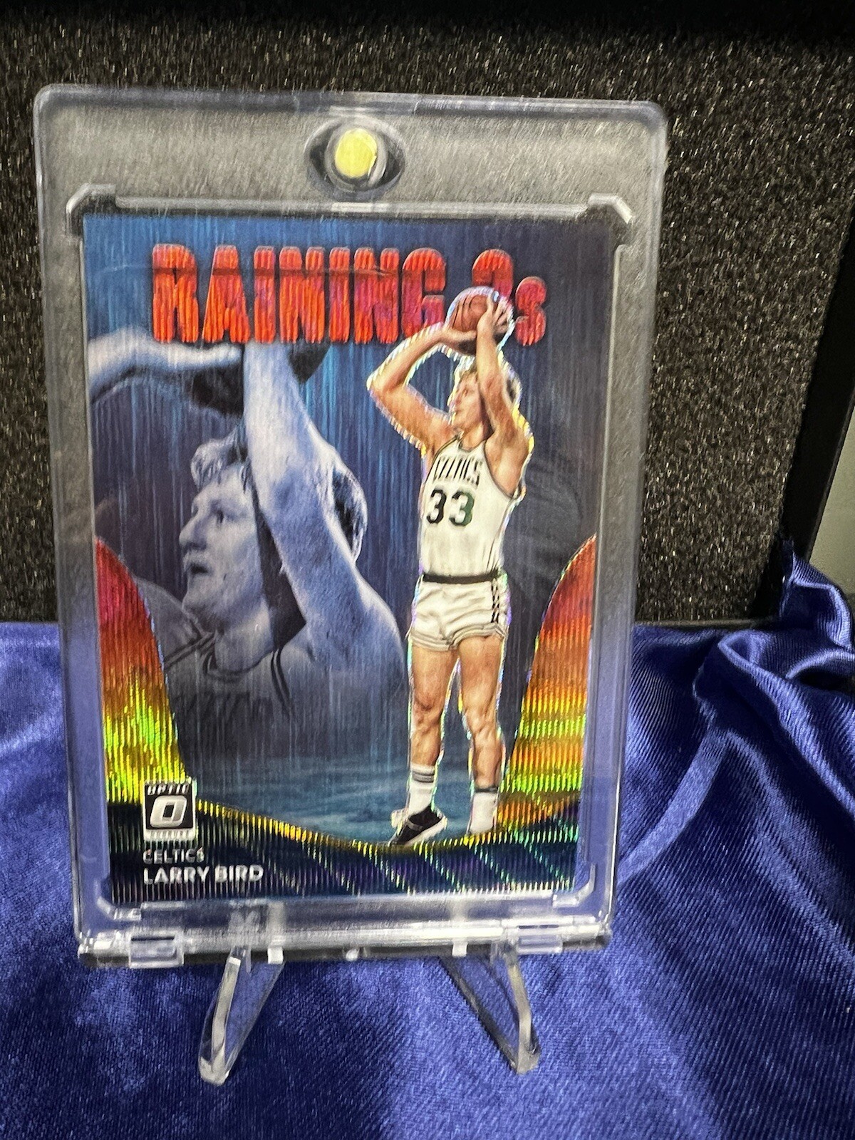 2022-23 Donruss Optic Raining 3s Larry Bird /99 Red and Gold Wave Prizm