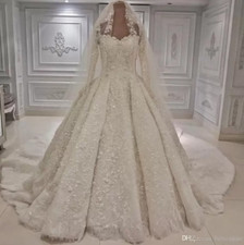 Luxurious Beaded Lace Ball Gown with Long Sleeves and Cathedral Train Wedding
