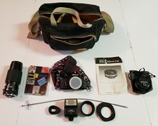 Nikon EM 35mm film camera with 50mm f1.8 Series-E lens, Tokina 80-200, sunpak