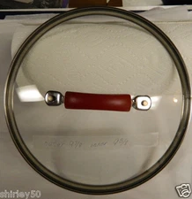 EXC. REPLACEMENT GLASS RIMMED LID 9 7/8" OUTER, 9 3/8" INNER RIM. RED HANDLE