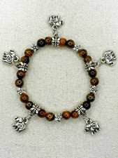 Brown Faux Tiger Eye Bead Silver Tone Flower And Elephant Charm Stretch Bracelet